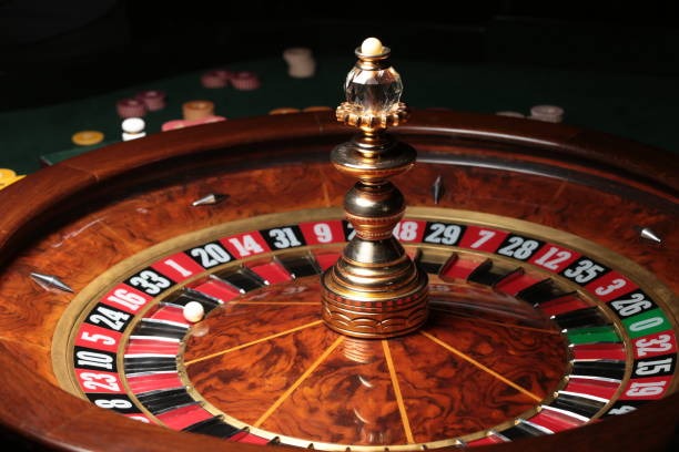 kawin77 Caribbean Stud Poker table showing player and dealer hands with payout table